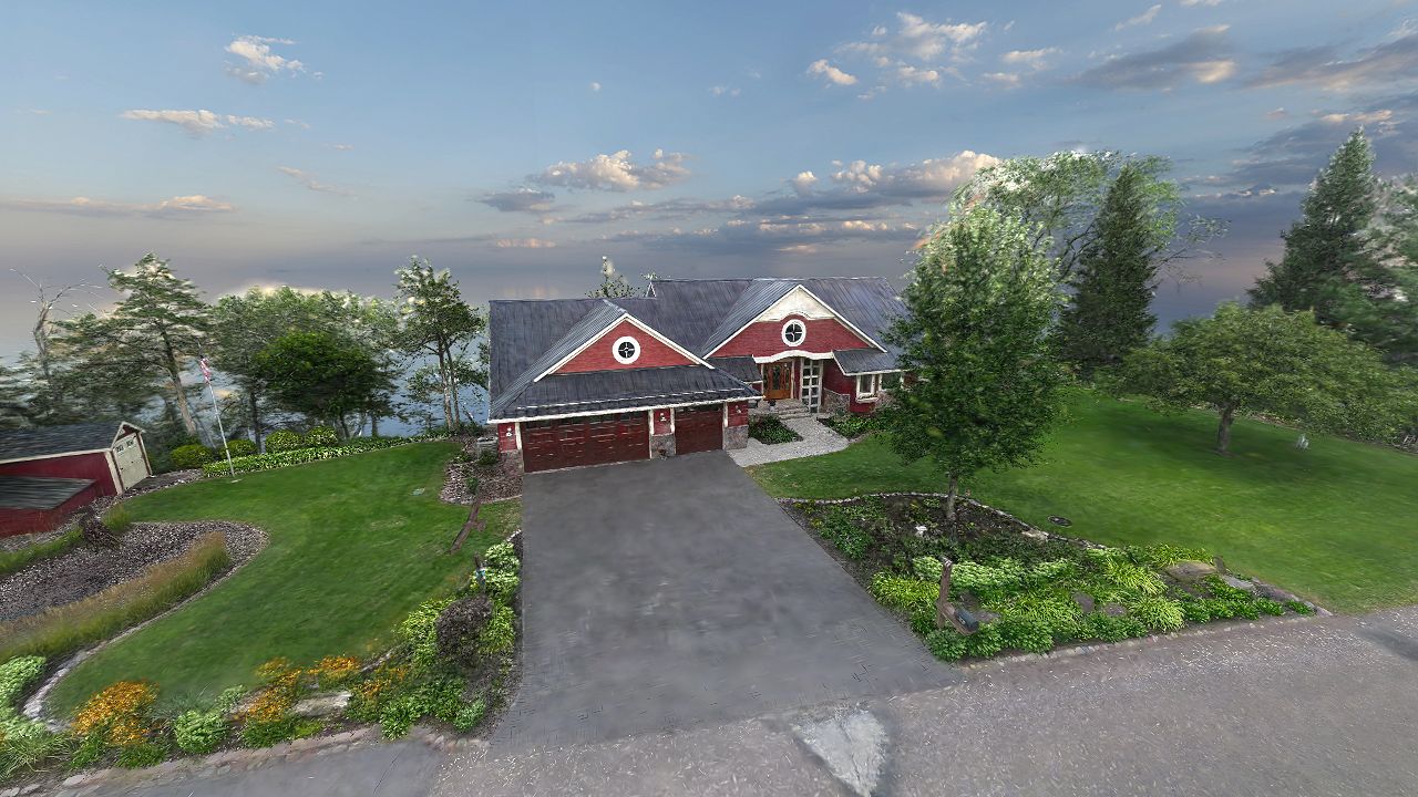 Captured house exterior with its driveway, landscaping and trees