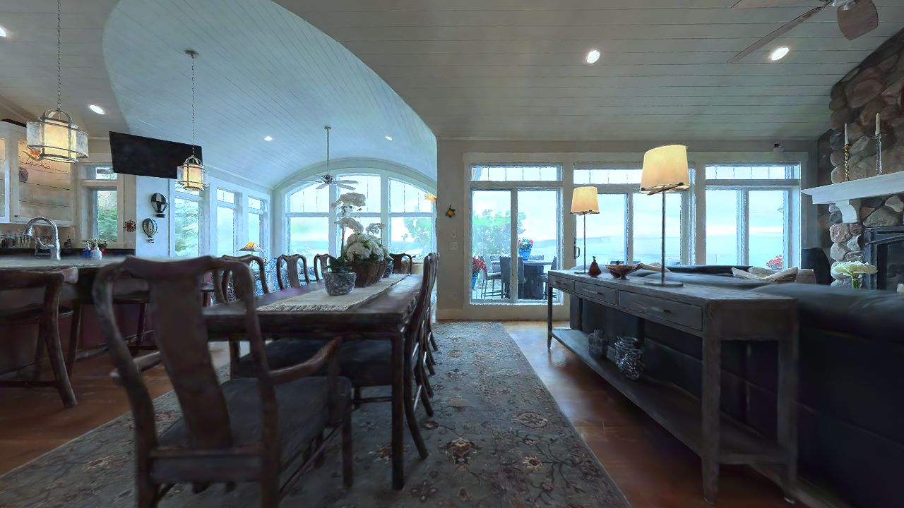 Captured living room, kitchen and dining area with large windows